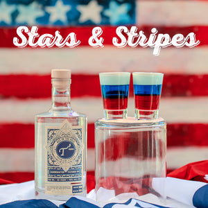 Bottle of T3 Vodka with two shot glasses filled with a red, white, and blue layered drink against an American flag background.